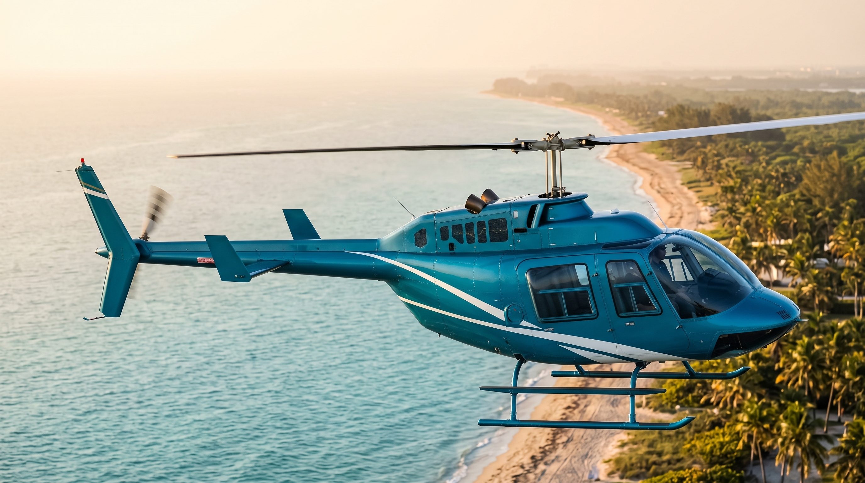 Blue and white Bell 206B JetRanger helicopter in flight